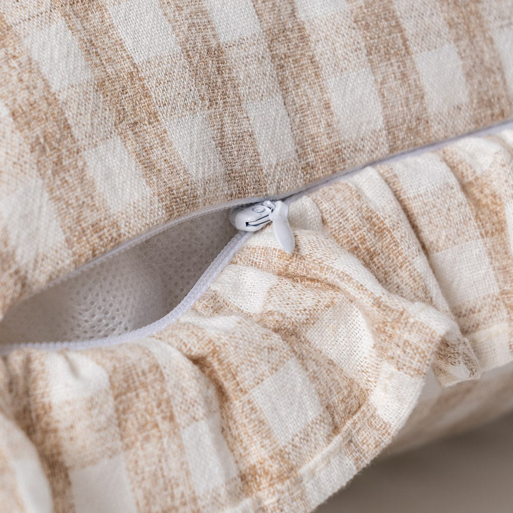 Close-up of ruffle edge detail on beige gingham cushion cover by Decor Petit