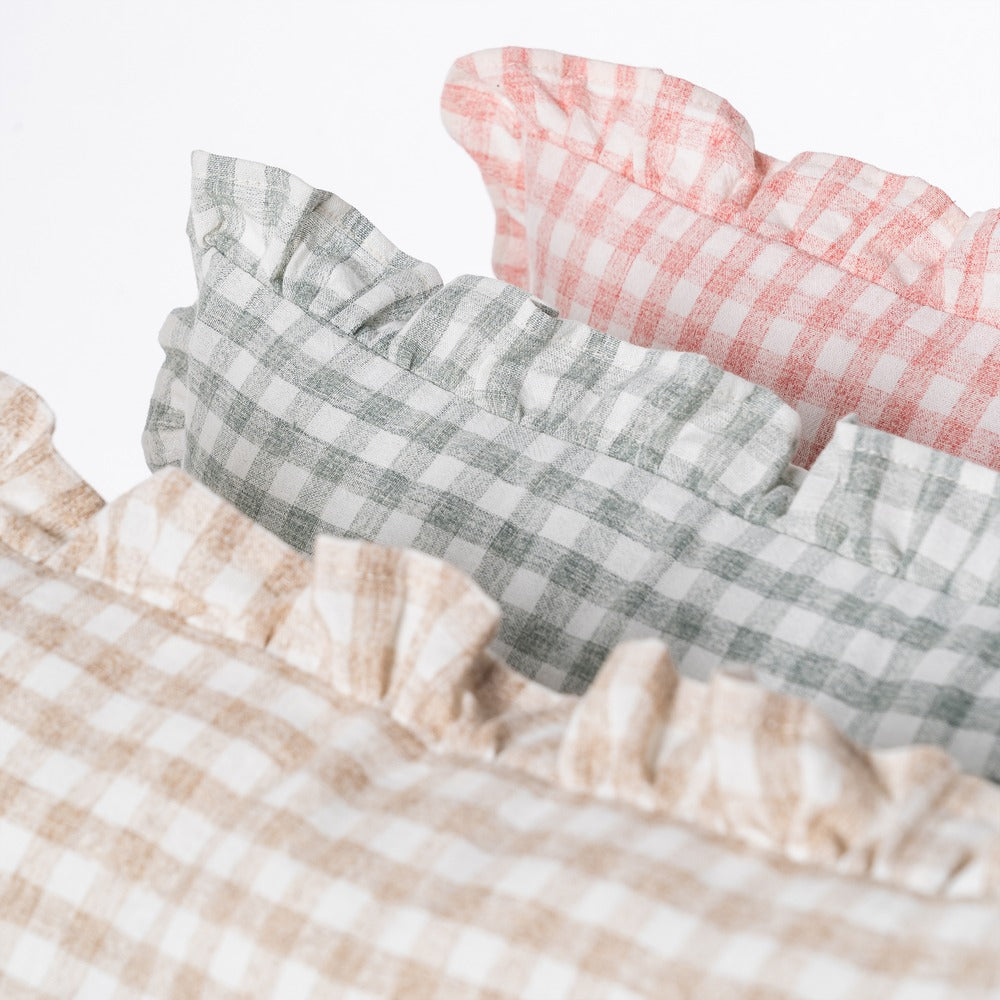 Gingham ruffle cushion styled on a linen bed, Clementine by Decor Petit