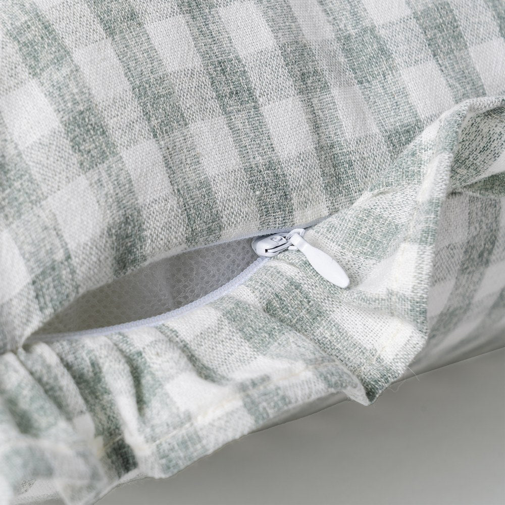 Close-up of ruffle edge detail on gray gingham cushion cover by Decor Petit