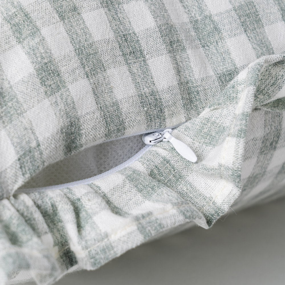 Close-up of ruffle edge detail on gray gingham cushion cover by Decor Petit