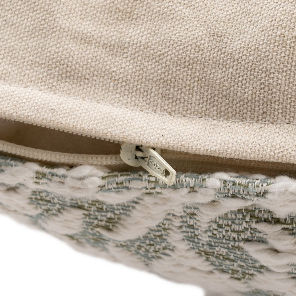 Close-up of white tufted floral texture on grey boucle cushion cover by Decor Petit