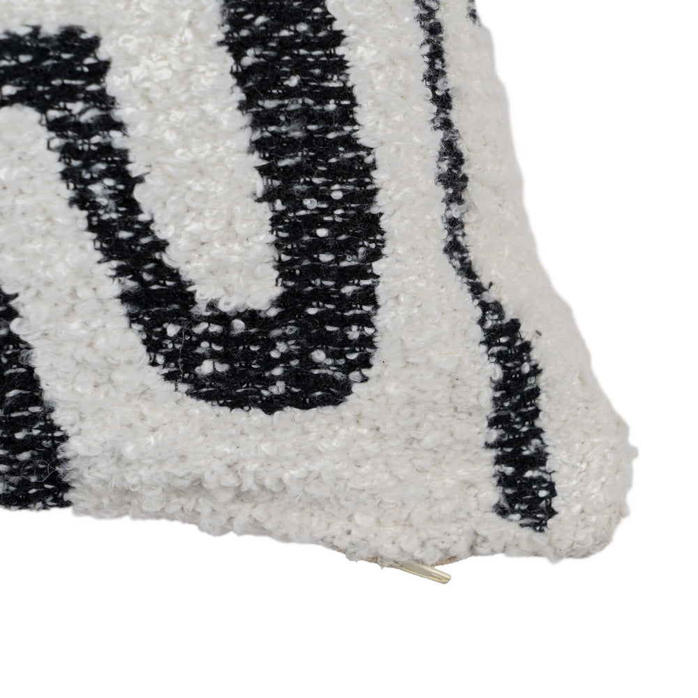 Close-up of a textured white and black cushion 