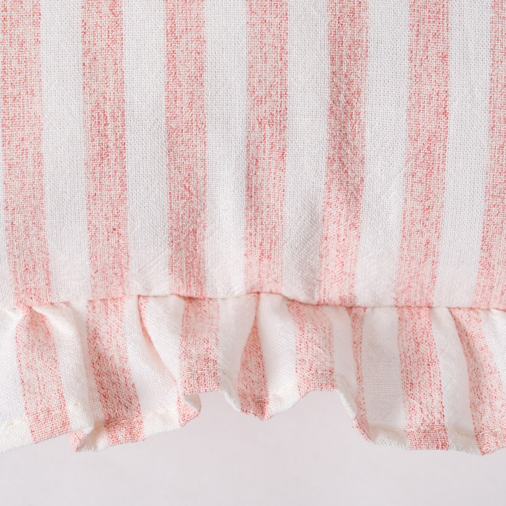 Close-up of ruffle edge detail on pink gingham cushion cover by Decor Petit